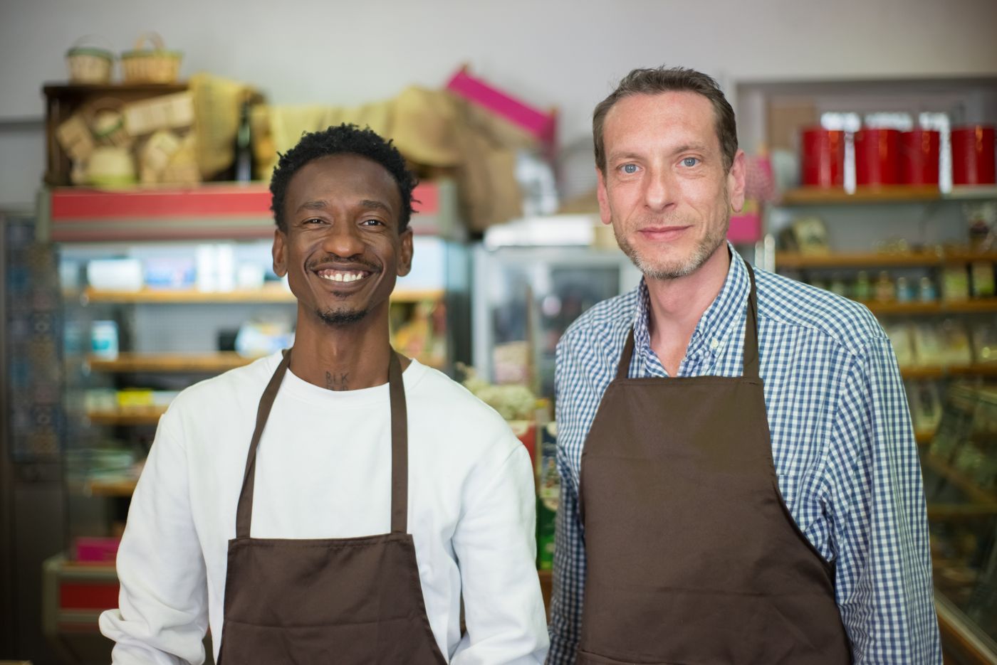 Two shop owners in their store